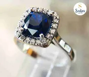 14 karat White gold ring with a Blue Sapphire and Diamonds