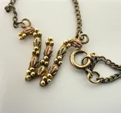 Landstrom's Black Hills Gold Letter W Initial Pendant