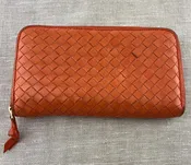 Bottega Veneta Orange Zip Around Intracato Wallet
