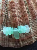Nine Small Sea Foam Green Pieces of Sea Glass on a Sterling Chain