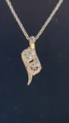 1.06cttw Mason County clear star brilliant cut topaz mounted in a 2 stone Continuum silver pendant.
