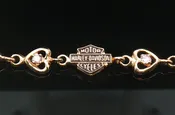 10K YELLOW GOLD HARLEY-DAVIDSON HEART BRACELET WITH PINK CZS, ESTATE