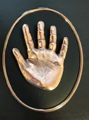 YOUNG CHILD WITH BROZED HANDPRINT & FOOT IMPRESSIONS