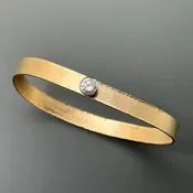 Matte Textured Gold Bracelet with a Stellar Diamond Center