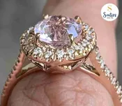 14 karat Rose Gold Ring set with Diamonds and Peach Sapphire