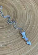 N21 Fresh Water Pearl Necklace — Lilly Barrack  Seasoned artist, Lilly Barrack, has been designing hand-made sterling silver gemstone jewelry for more than three decades. The Lilly Barrack’s three store locations (two in Albuquerque, NM, and one in Scottsdale, AZ.) carry exclusive gift items and designs from upwards of 60 unique artists.