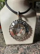 1.45ct clear star brilliant Texas topaz in a cinco peso coin pendant